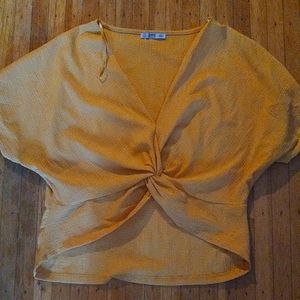 Gold crop top with twist